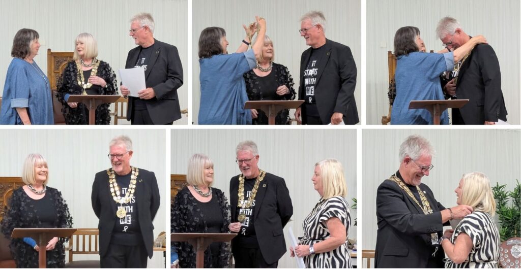 The Mayoral chain being exchanged from outgoing Mayor, Councillor Pat Fraser to new Mayor, Councillor Keith Butterick. 
