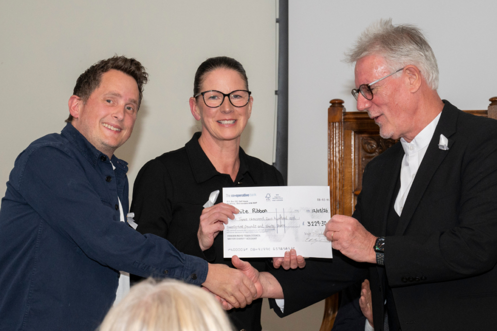 Cllr Keith Butterick presents White Ribbon UK with a donation