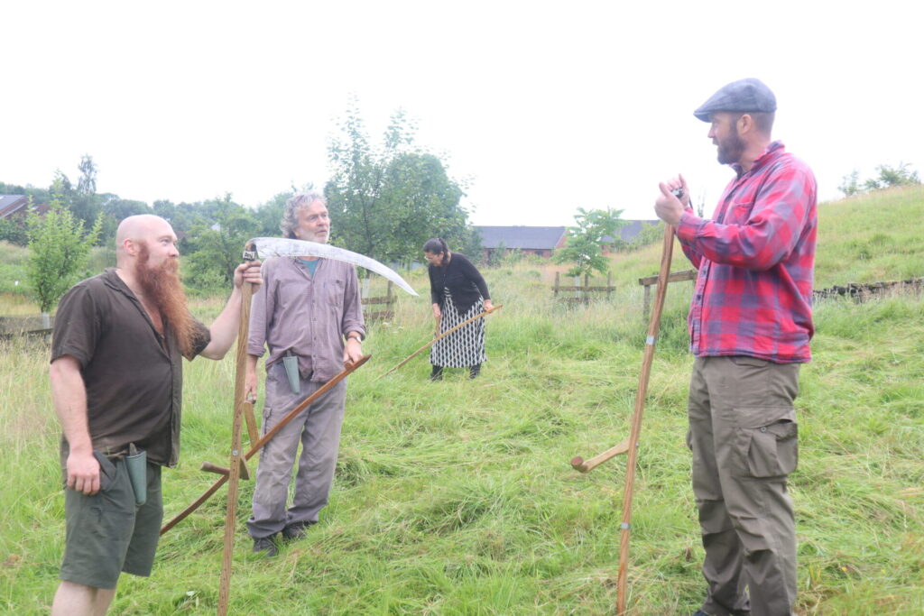 A group of volunteers for the scything demonstration at Meadows Day 2026