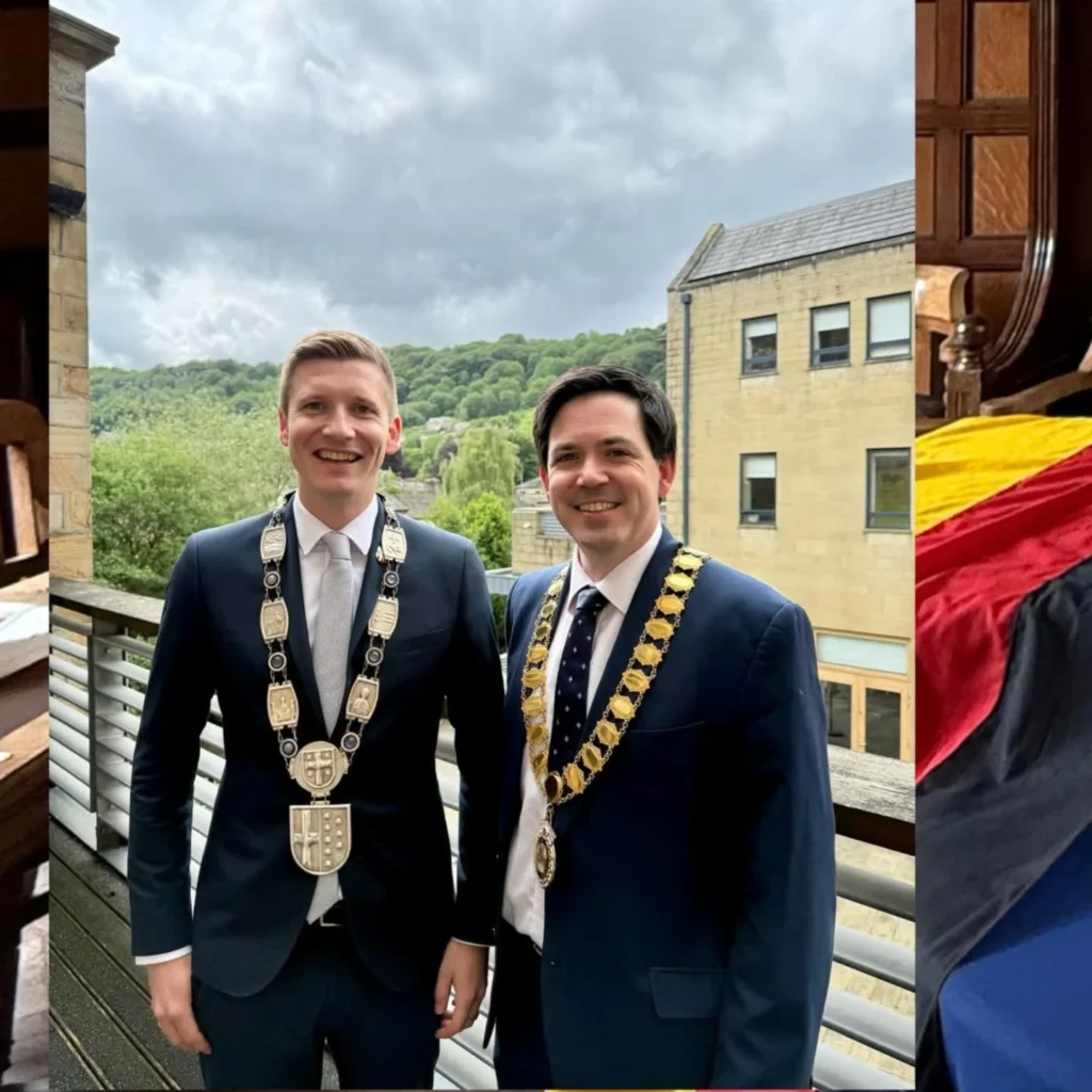Two town mayors, from Hebden ROyd and Warstein in Germany, stand side by side