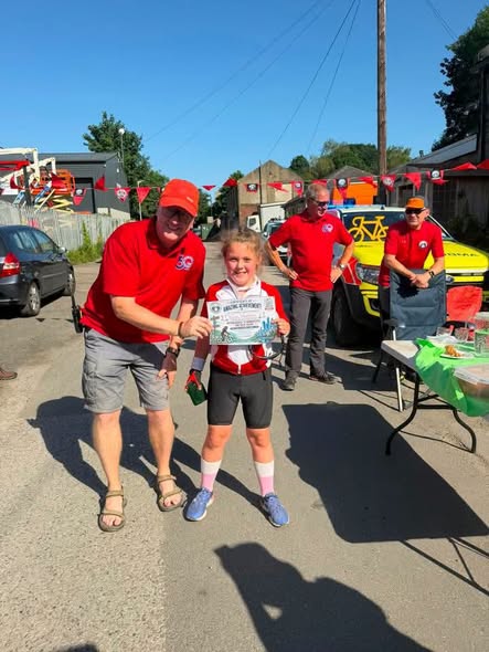 8 year old WInnie is presented with a certificate