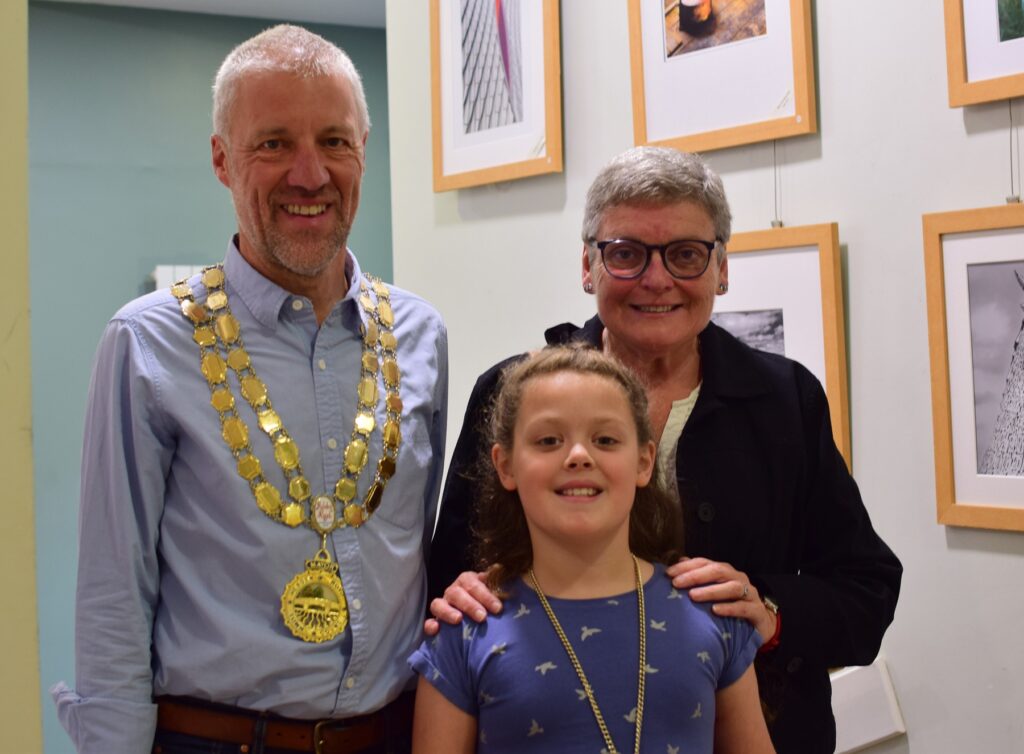 The Mayor of Hebden Royd Town Council stands with his two Consorts at the opening of the Hebden Bridge Camera Club Exhibition 2026.