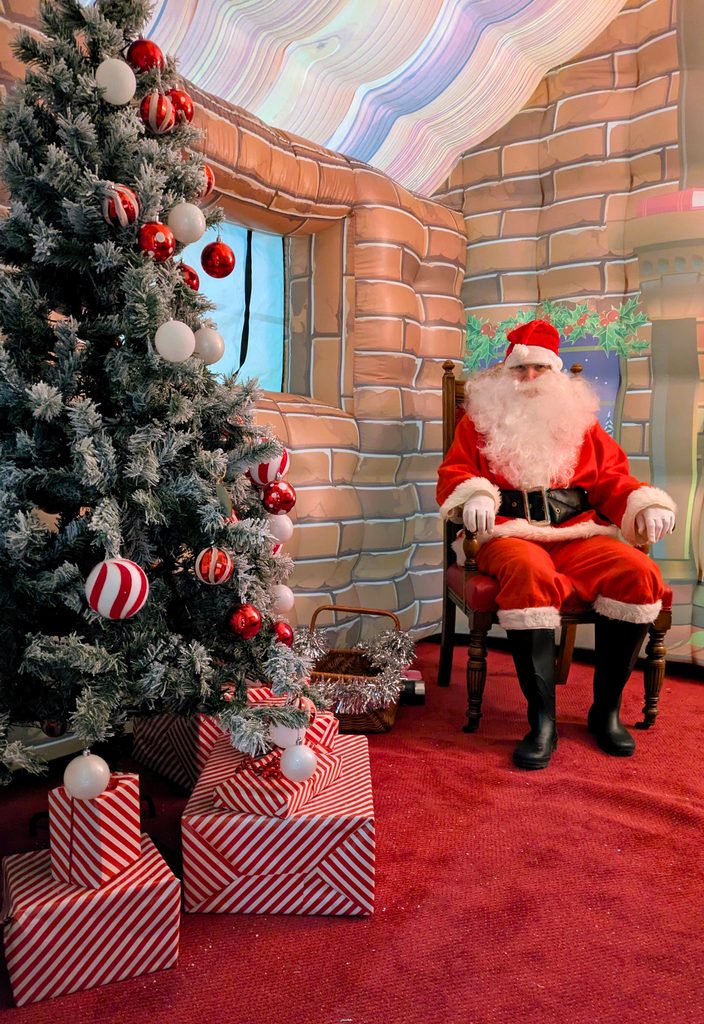 Santa waits to greet local children at the Grotto in Mytholmroyd, 2025.