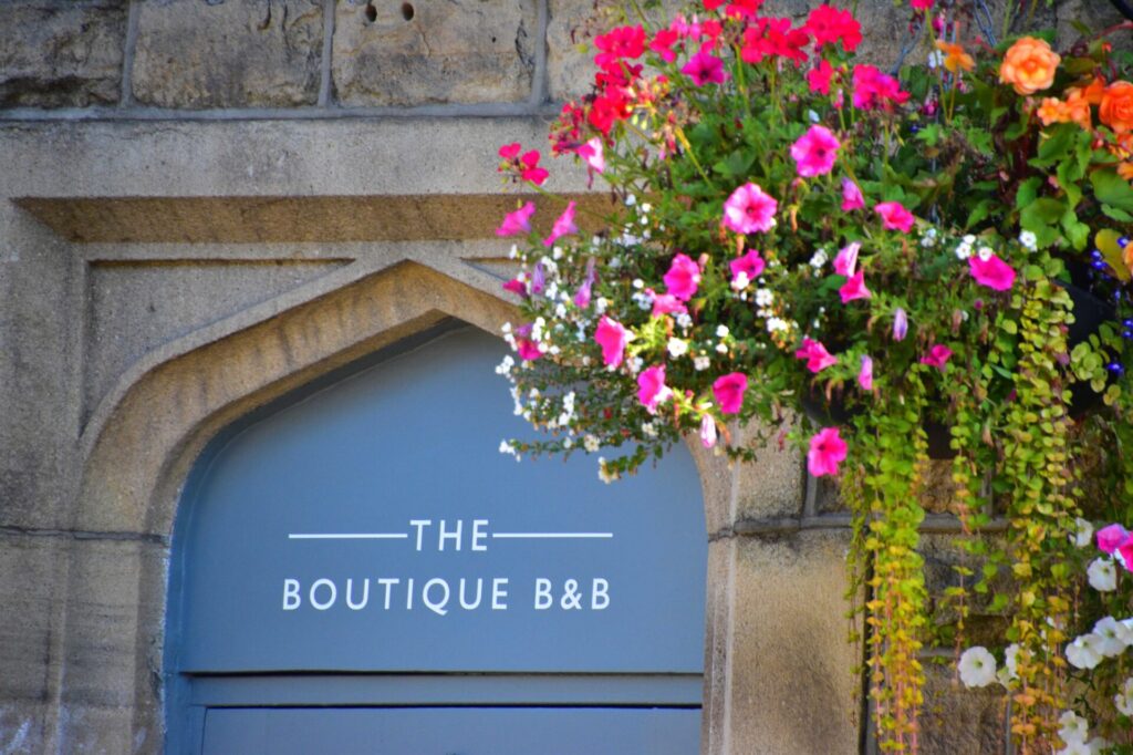A hanging basket in bloom outside Hebden Townhouse in Hebden Bridge, September 2026